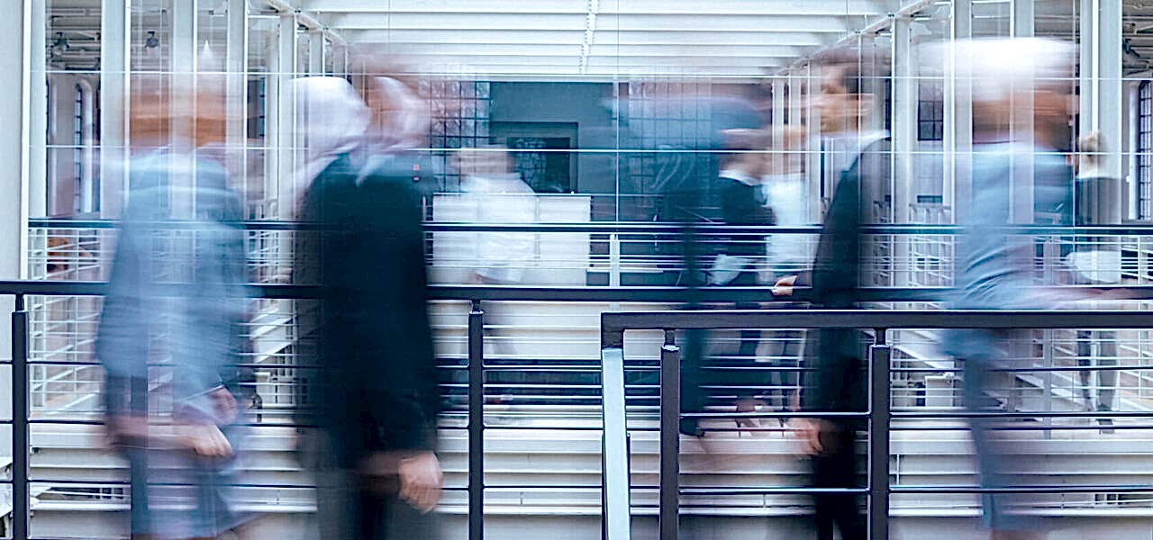 business-people-talking-in-corridor-PSVCLEM(1)